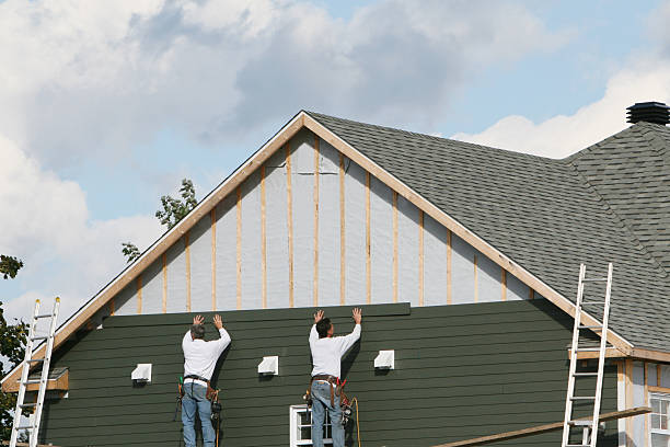 Professional Storm Damage Siding Repair technician working in Geneva, OH